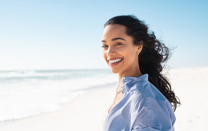 Lady smiles on beach