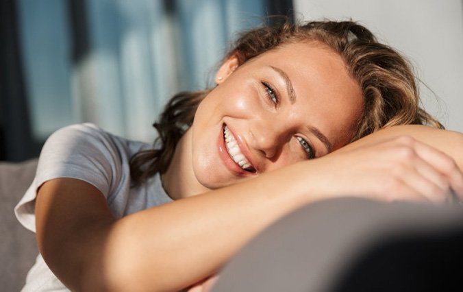 Lady smiles on chair