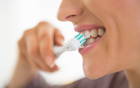 a patient brushing their teeth