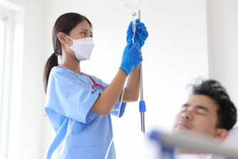 Dentist administering IV sedation